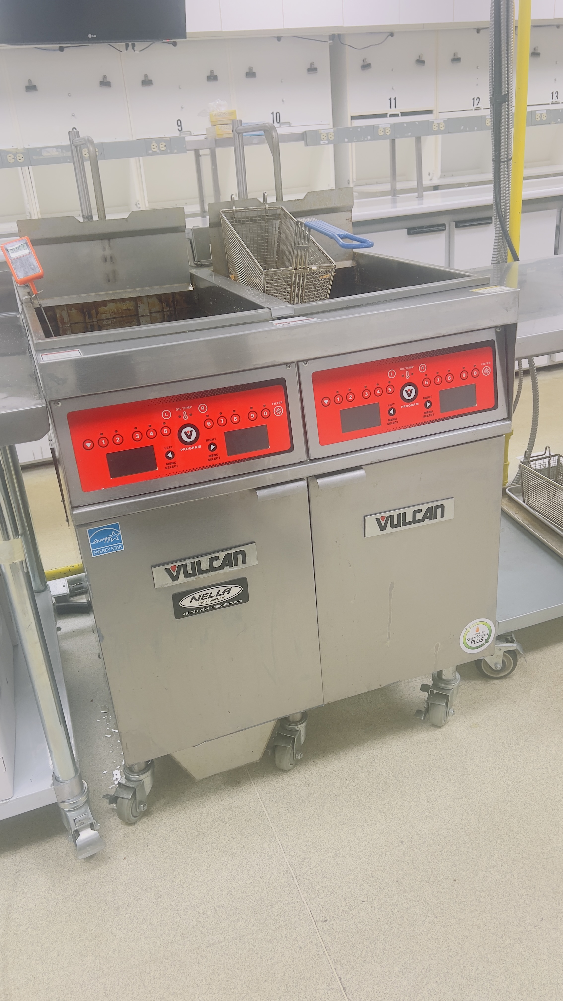 Commercial kitchen fryer repair technician at work